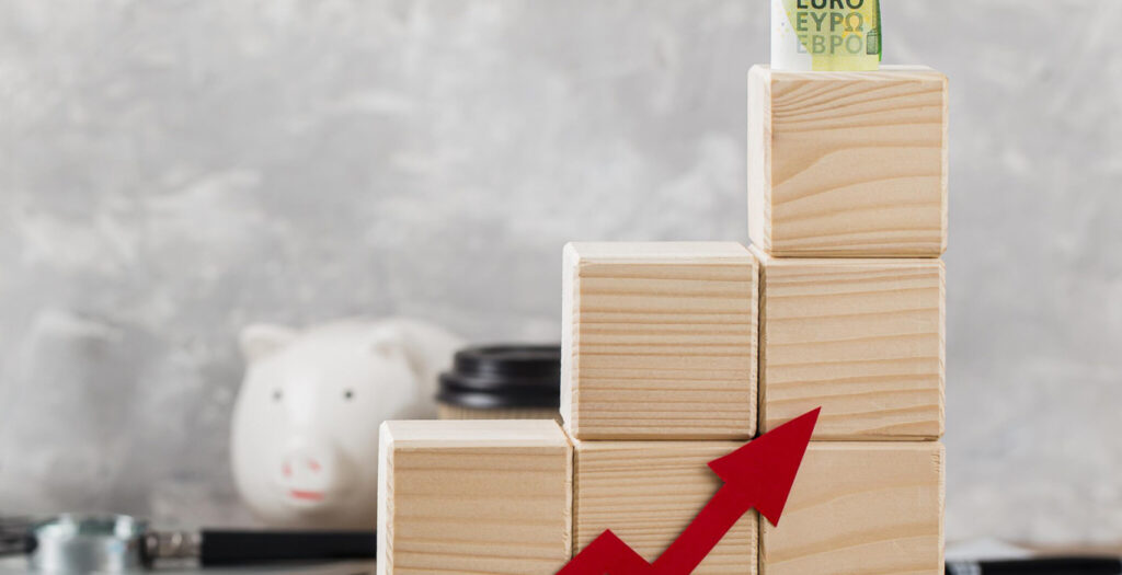 wooden-growth-blocks-with-banknotes